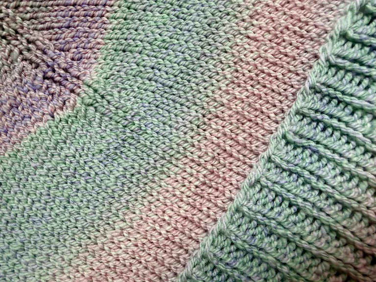 A close up of the hat at angle, such that you can see the purple at the top