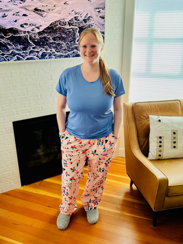 Same woman, some PJ pants, just in front of a TV on my wall this time