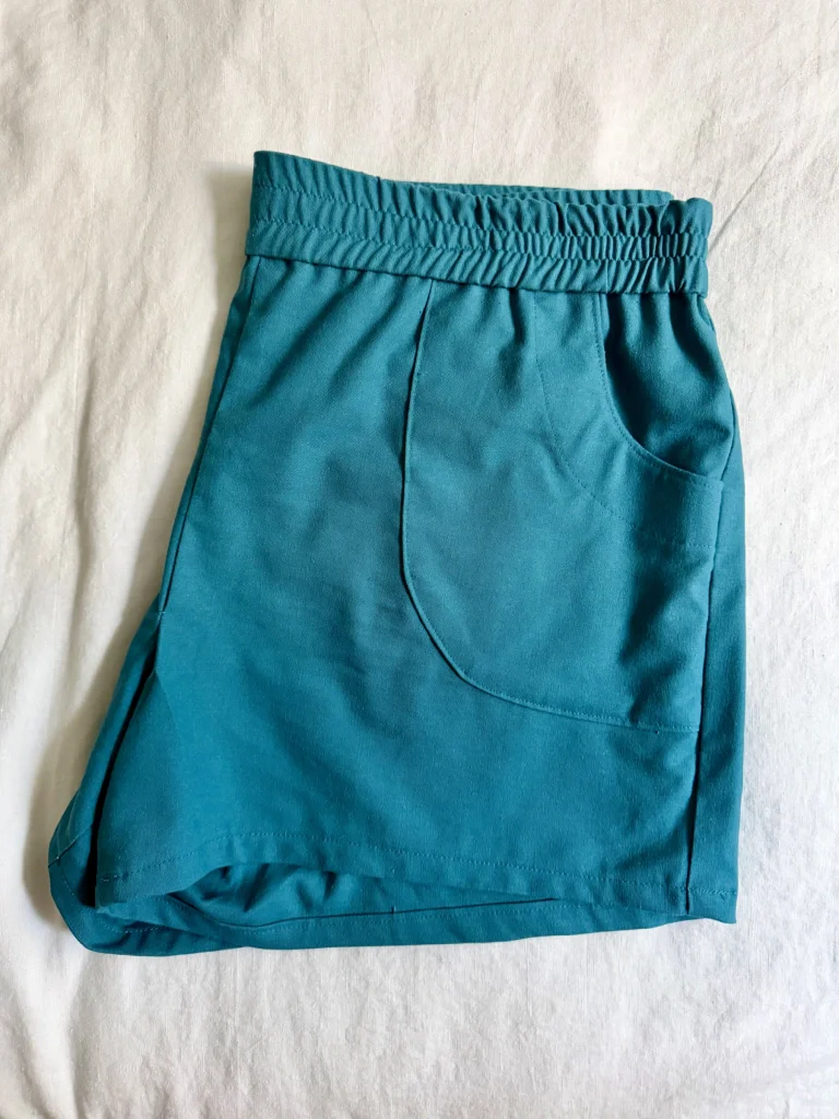 The shorts folded on a bed