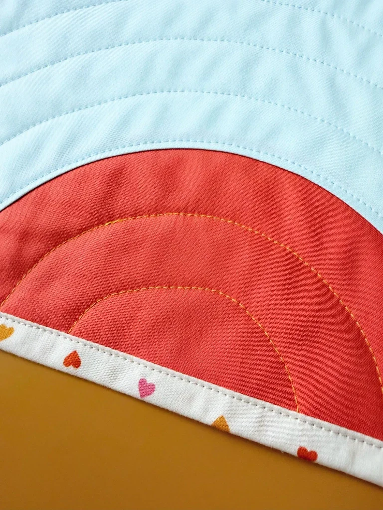 A closeup of the mug rug at a jaunty angle