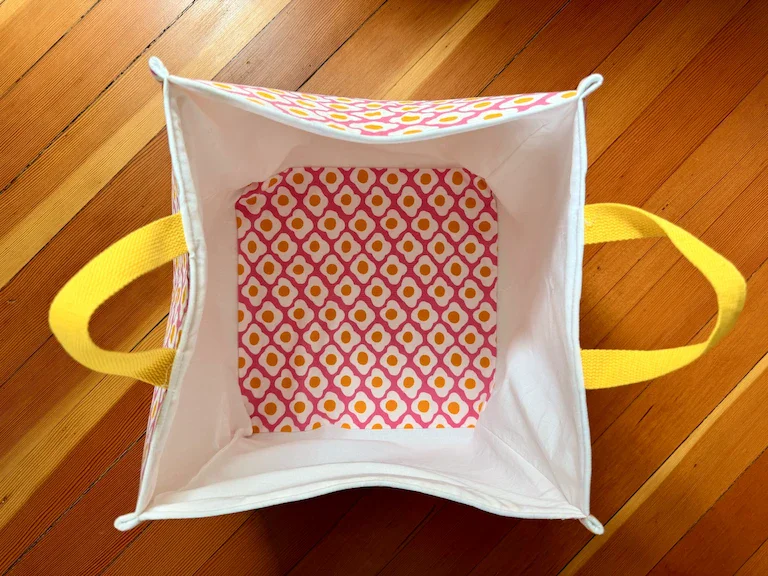 The interior of the egg bucket, showing white fabric except for the bottom, which has the egg fabric